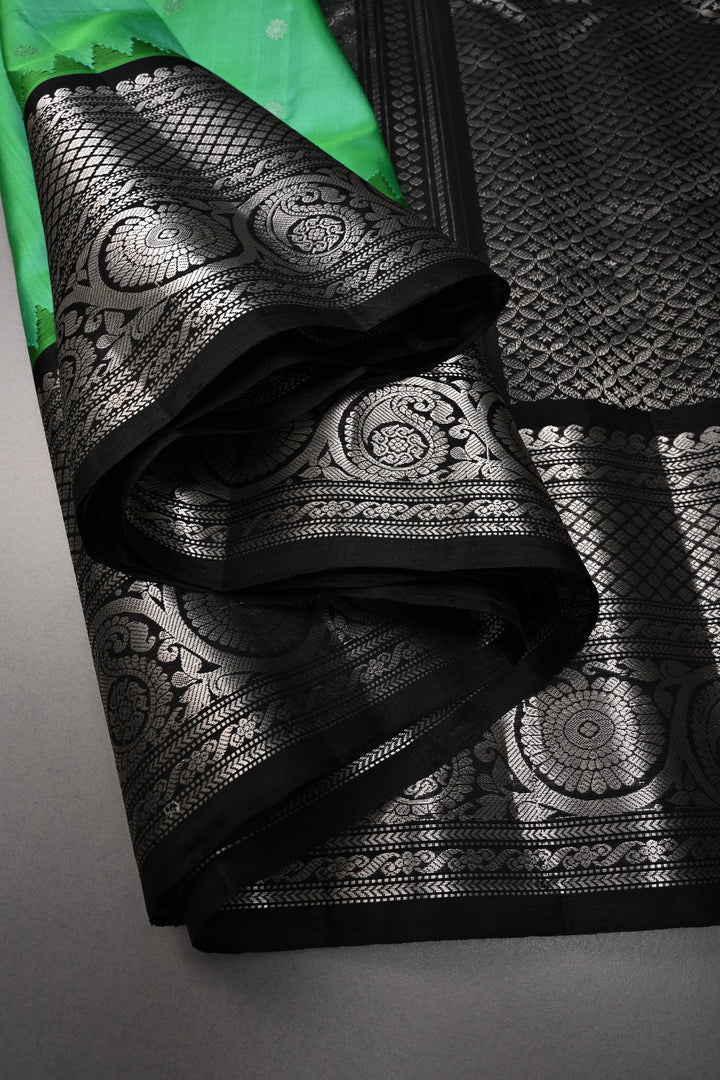 Sea Green Pure Gadwal Silk Saree with Silver Buttas and Contrast Black Zari Border| SILK MARK CERTIFIED | SHOBITAM