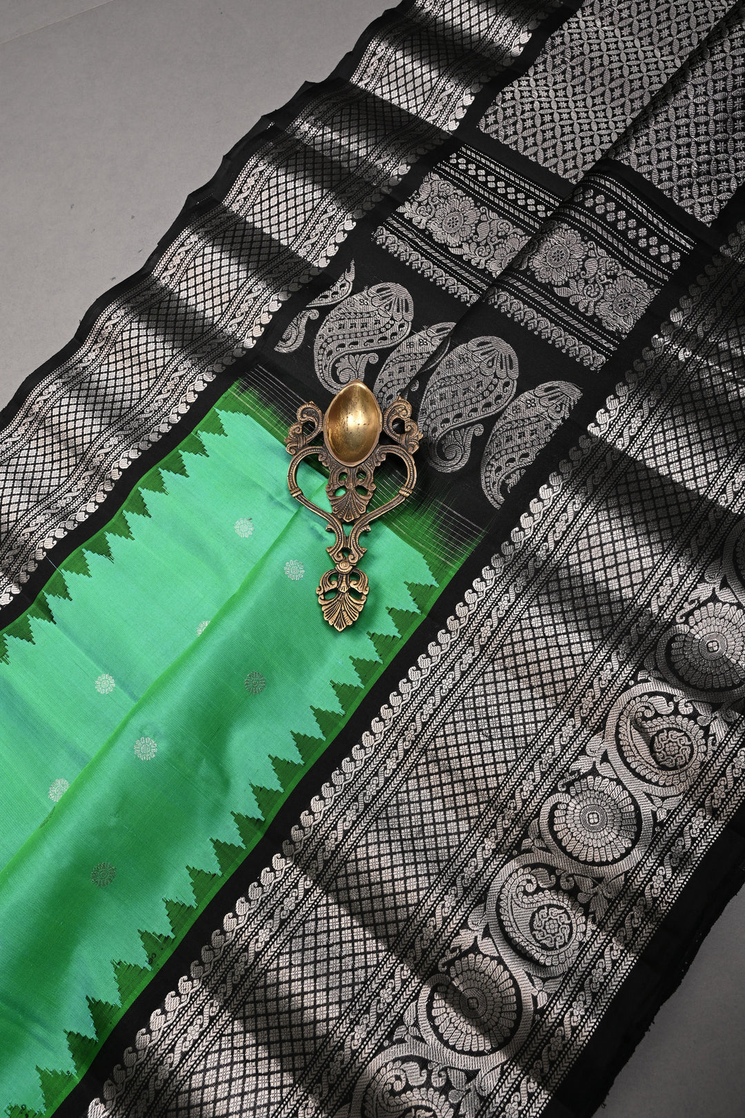 Sea Green Pure Gadwal Silk Saree with Silver Buttas and Contrast Black Zari Border| SILK MARK CERTIFIED | SHOBITAM