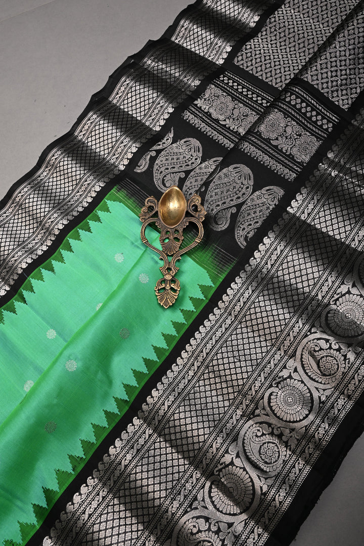 Sea Green Pure Gadwal Silk Saree with Silver Buttas and Contrast Black Zari Border| SILK MARK CERTIFIED | SHOBITAM