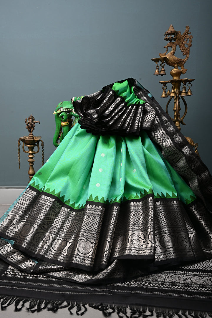 Sea Green Pure Gadwal Silk Saree with Silver Buttas and Contrast Black Zari Border| SILK MARK CERTIFIED | SHOBITAM