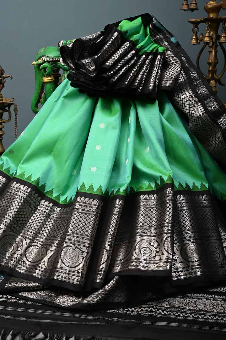 Sea Green Pure Gadwal Silk Saree with Silver Buttas and Contrast Black Zari Border| SILK MARK CERTIFIED | SHOBITAM