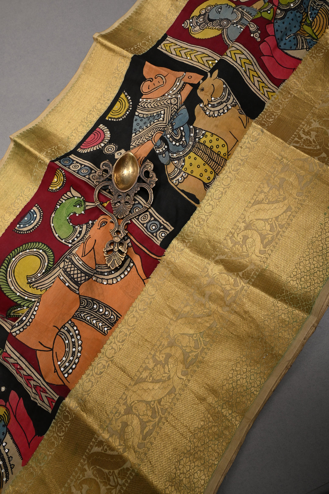 Mythological and folk Art theme : Authentic Pen kalamkari Handpainted on Pure Chennuri Silk Saree with Sequins Work and Contrast Zari Border | SHOBITAM