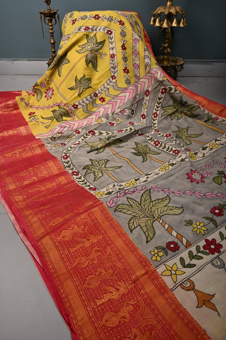 Floral and Palm Tree Theme : Yellow Authentic Pen kalamkari Handpainted on Pure Chennuri Silk Saree with Dancing Queens Zari Border | SHOBITAM