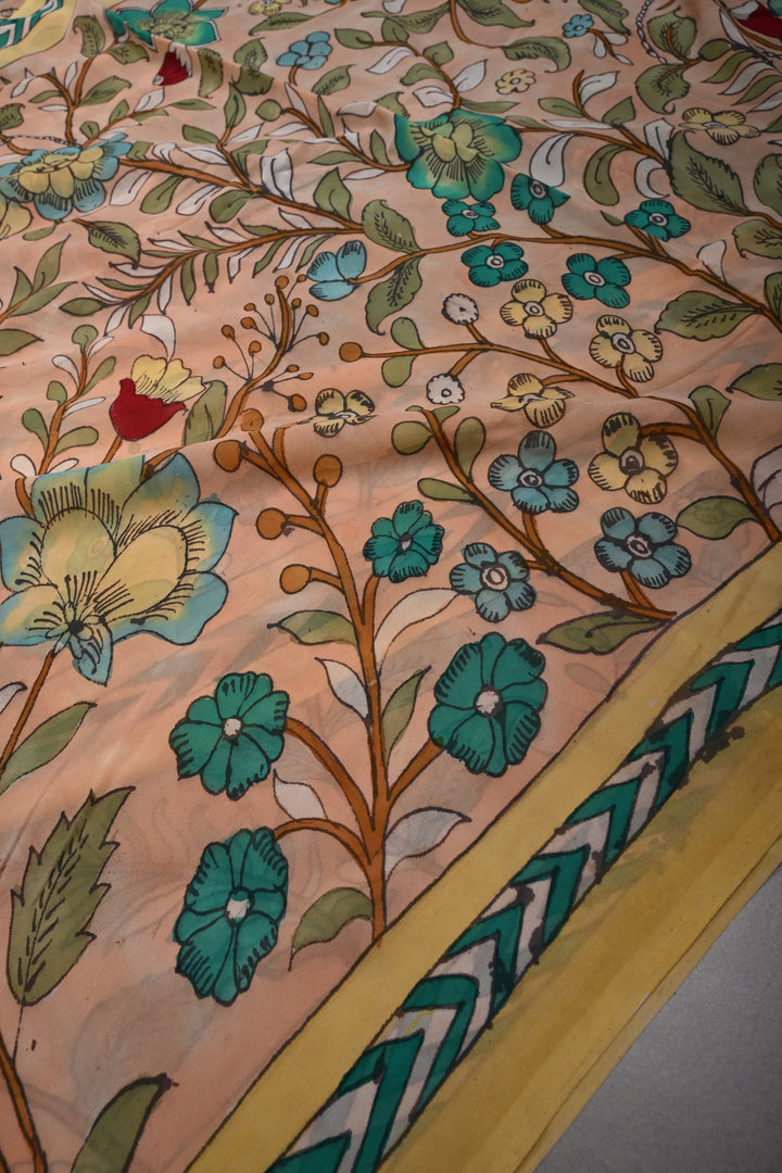 Floral Theme : Light Peach Authentic Pen Kalamkari Handpainted  on pure Georgette Silk Saree with Minimal Border | SILK MARK CERTIFIED | SHOBITAM