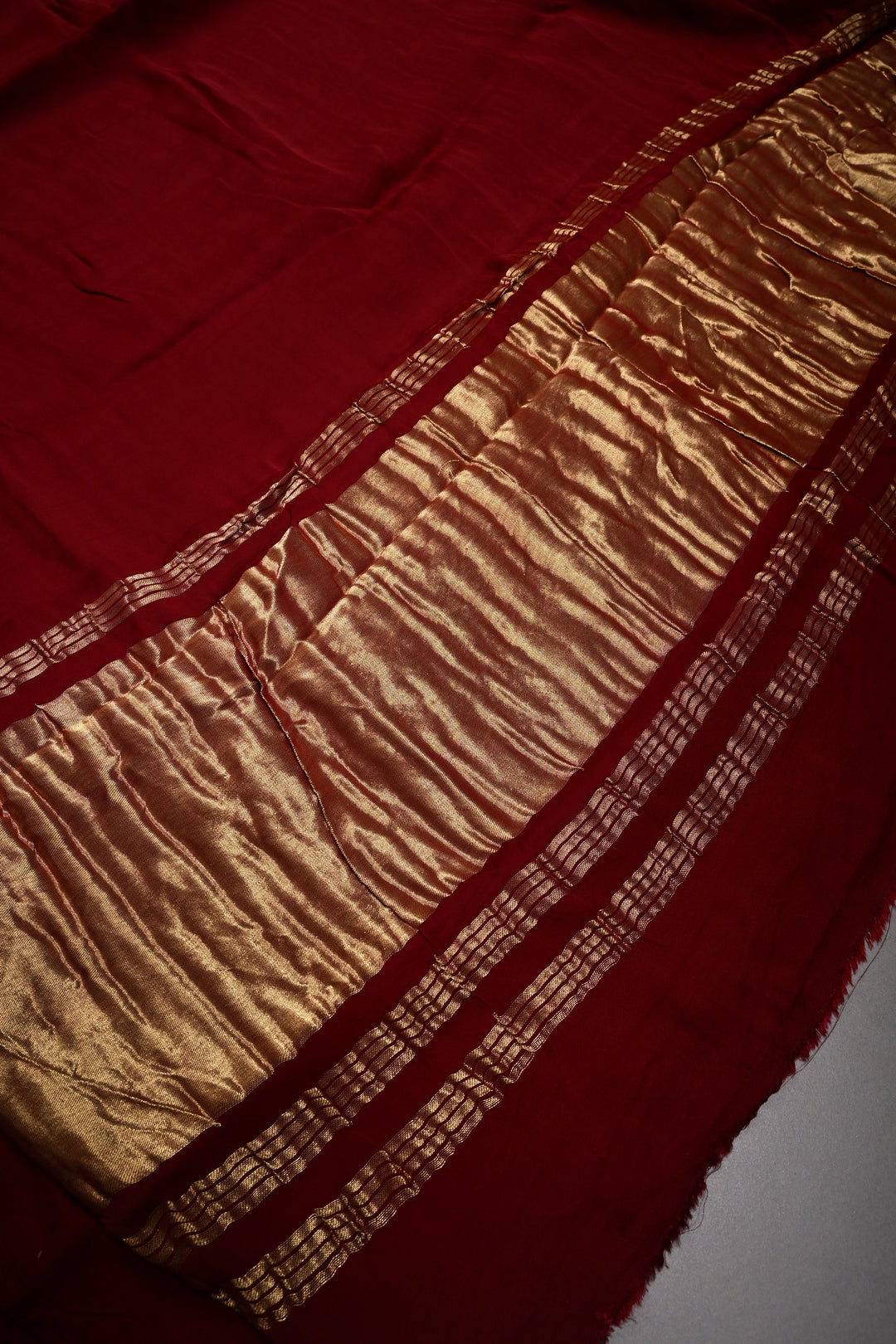 Burgundy Borderless Modal Silk Saree with Lagda Patta Crushed Tissue Pallu | SHOBITAM