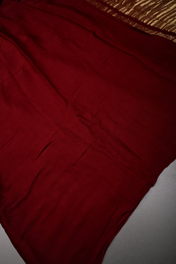 Burgundy Borderless Modal Silk Saree with Lagda Patta Crushed Tissue Pallu | SHOBITAM