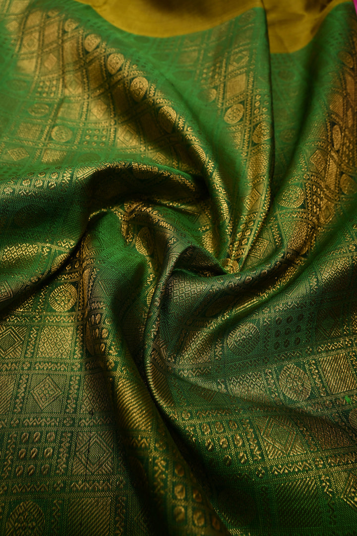Moss Yellow Kanjivaram Pure Silk Saree with half Brocade Border in Lead Green and Pink Contrast Pallu| SILK MARK CERTIFIED | SHOBITAM