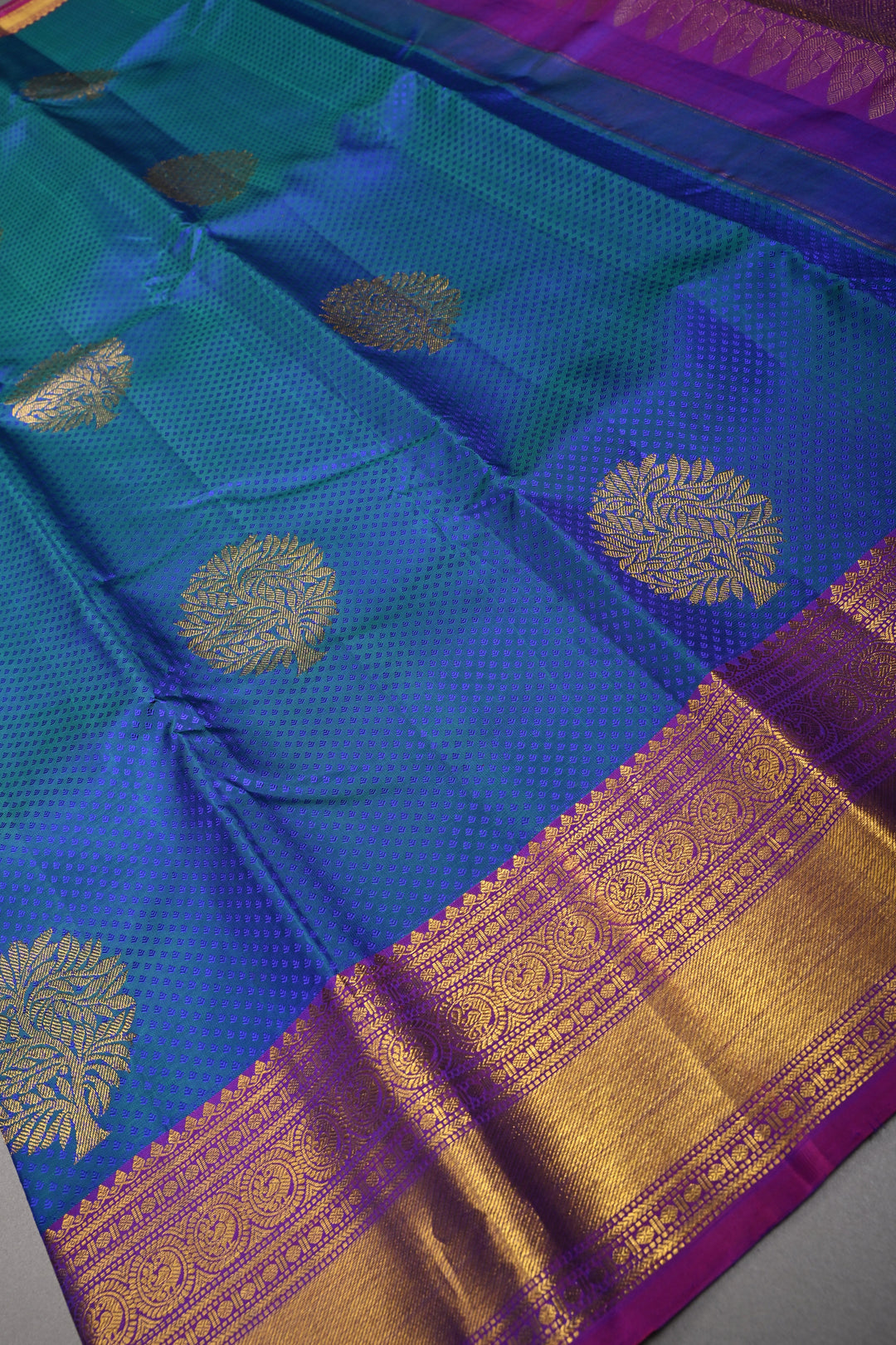 Blue-Green Dual Tone Brocade on Pure Kanjivaram Silk Handloom Saree with Zari Buttas and Contrast Zari Border | SILK MARK CERTIFIED | SHOBITAM