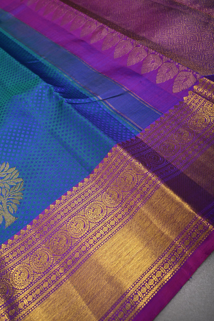 Blue-Green Dual Tone Brocade on Pure Kanjivaram Silk Handloom Saree with Zari Buttas and Contrast Zari Border | SILK MARK CERTIFIED | SHOBITAM