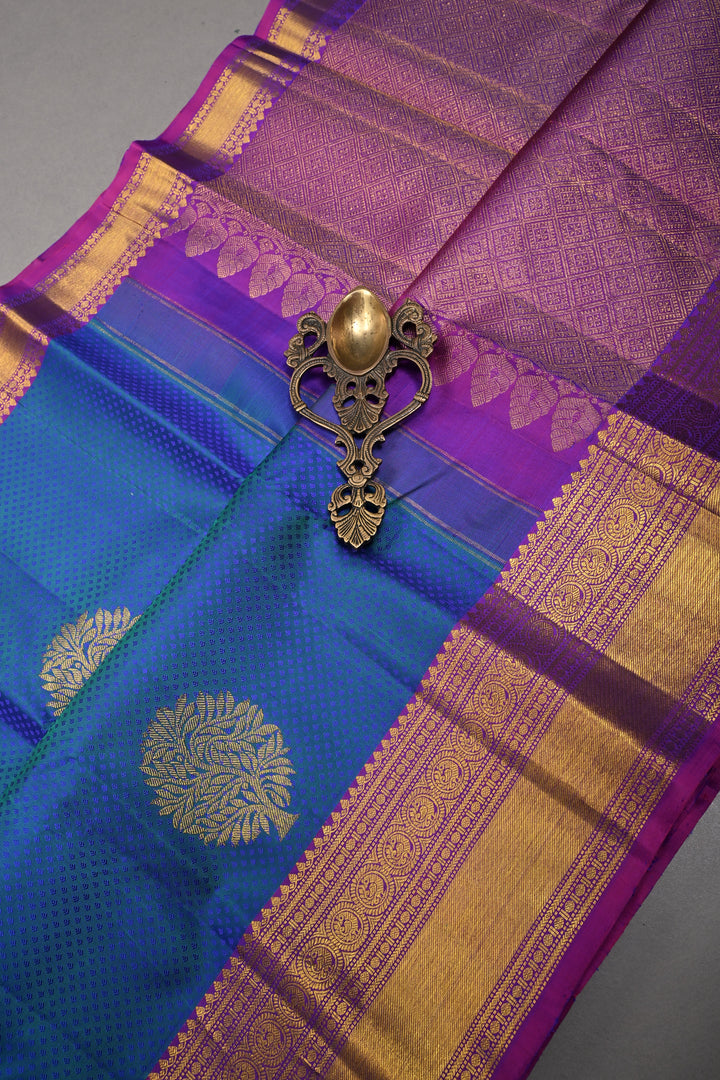 Blue-Green Dual Tone Brocade on Pure Kanjivaram Silk Handloom Saree with Zari Buttas and Contrast Zari Border | SILK MARK CERTIFIED | SHOBITAM