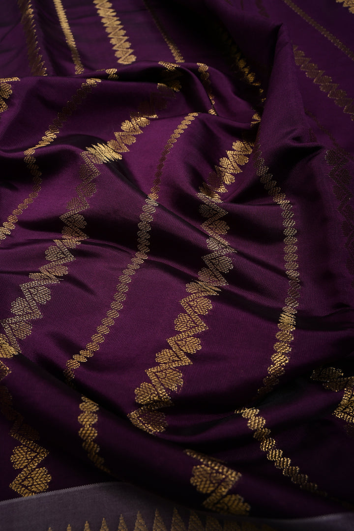 Plum Kanjivaram Soft Silk Semi Saree with Ornate Zari Stripes and Rettaipet Zari Border | SHOBITAM
