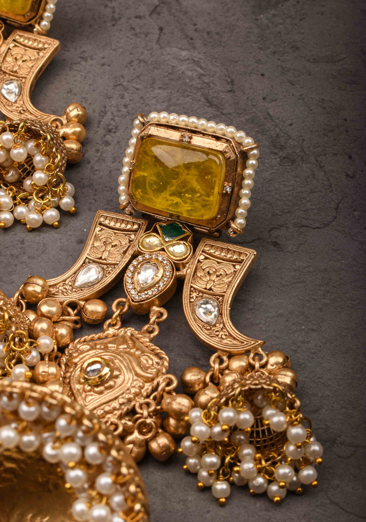 Tiger Claw design Gold tone Jhumka Earrings with Green White Yellow Stones
