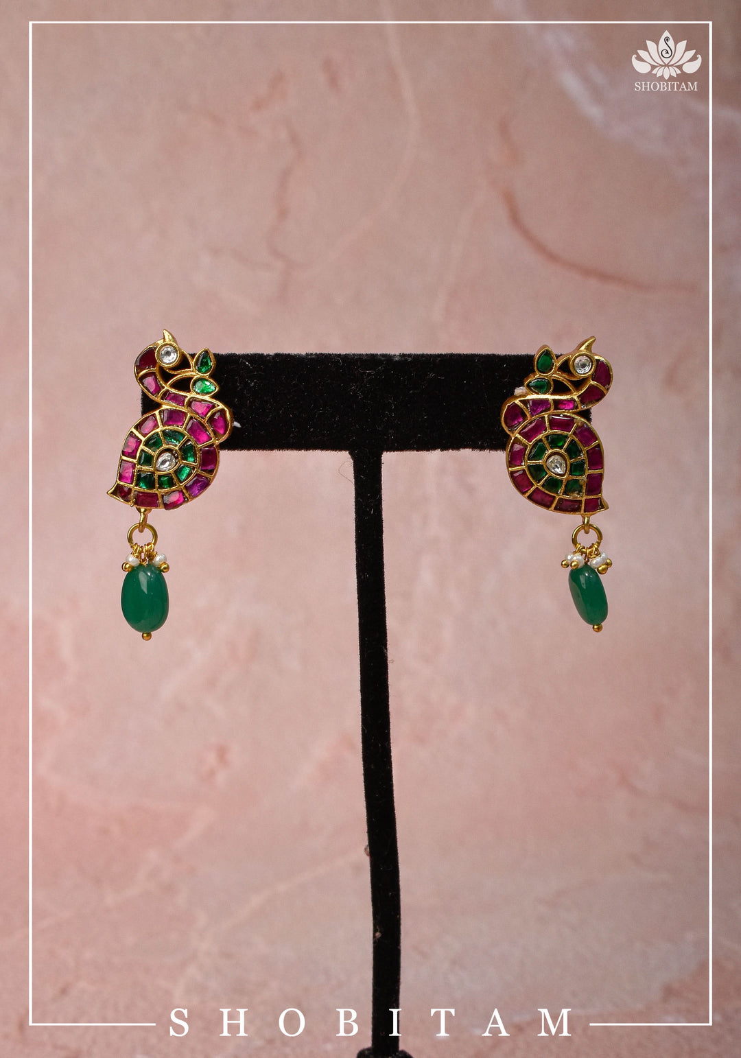 Handcrafted Jadau Peacock Earrings in Pink ,Green and  White color with dangling Green Bead | Shobitam Jewelry