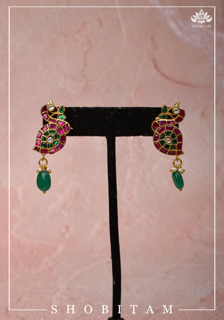 Handcrafted Jadau Peacock Earrings in Pink ,Green and  White color with dangling Green Bead | Shobitam Jewelry