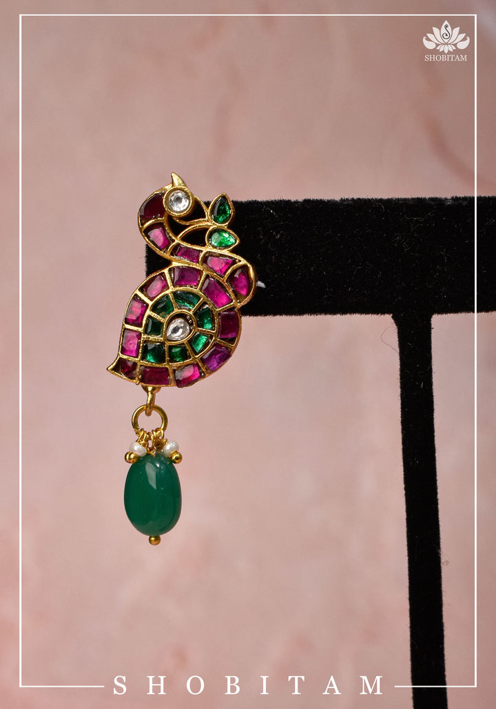Handcrafted Jadau Peacock Earrings in Pink ,Green and  White color with dangling Green Bead | Shobitam Jewelry