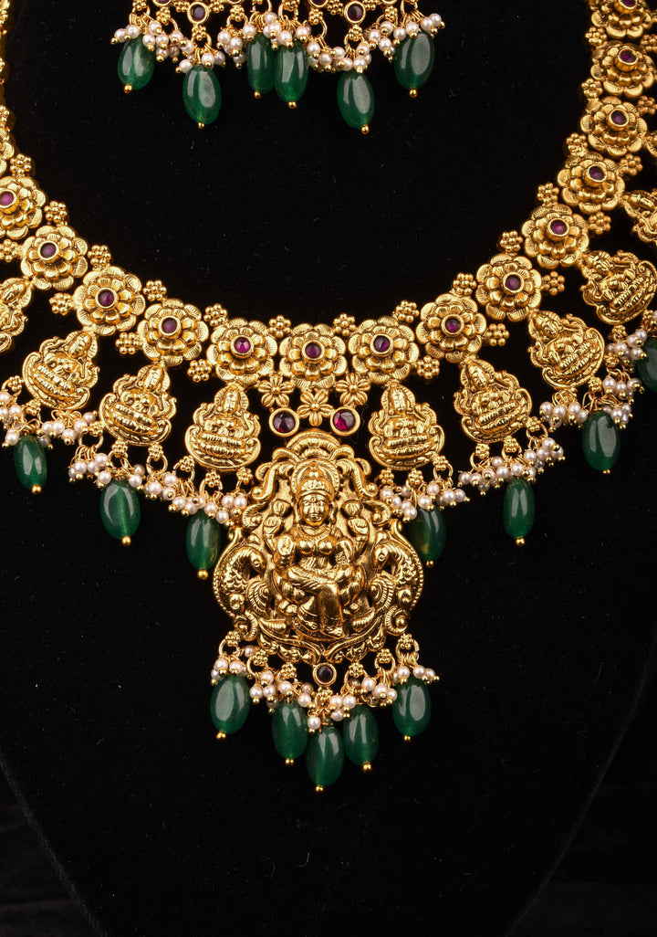 Jadau Lakshmi Necklace Set with Pink Stones dangling Green Beads | Shobitam Jewelry