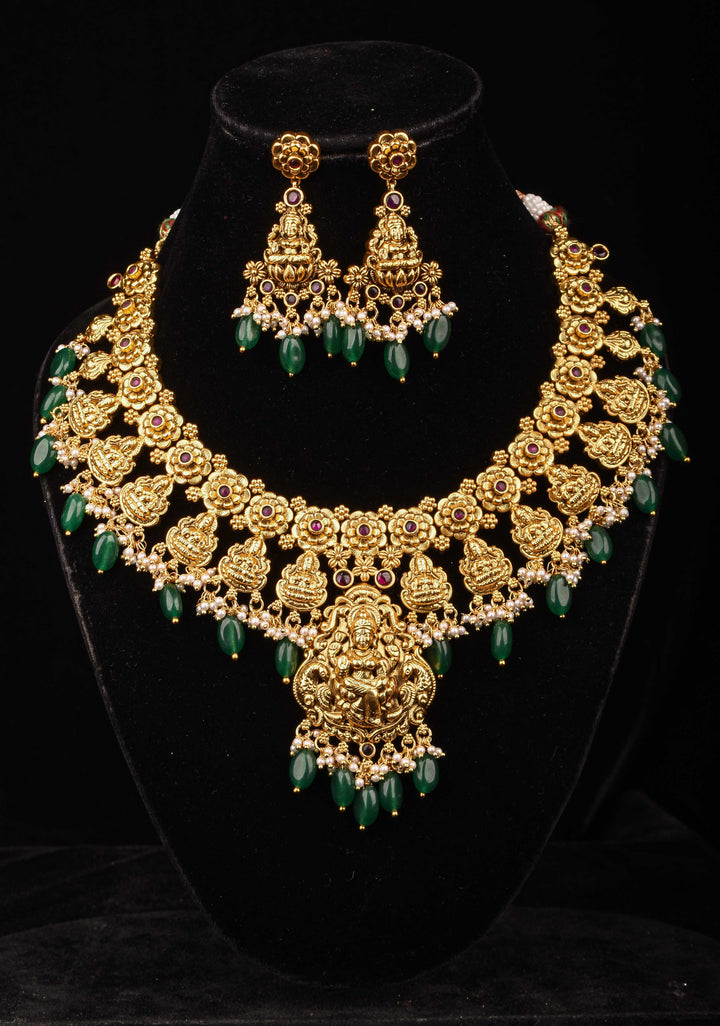 Jadau Lakshmi Necklace Set with Pink Stones dangling Green Beads | Shobitam Jewelry