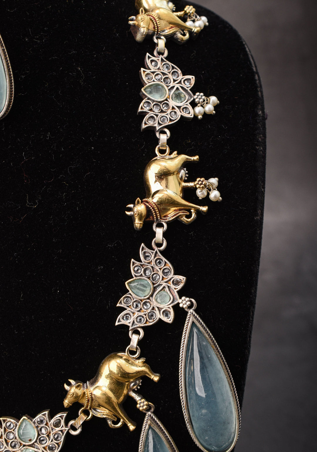 Fusion Dual Tone Jewelry with Pichwai Cow Units and Heather Blue Stones | Shobitam Jewelry