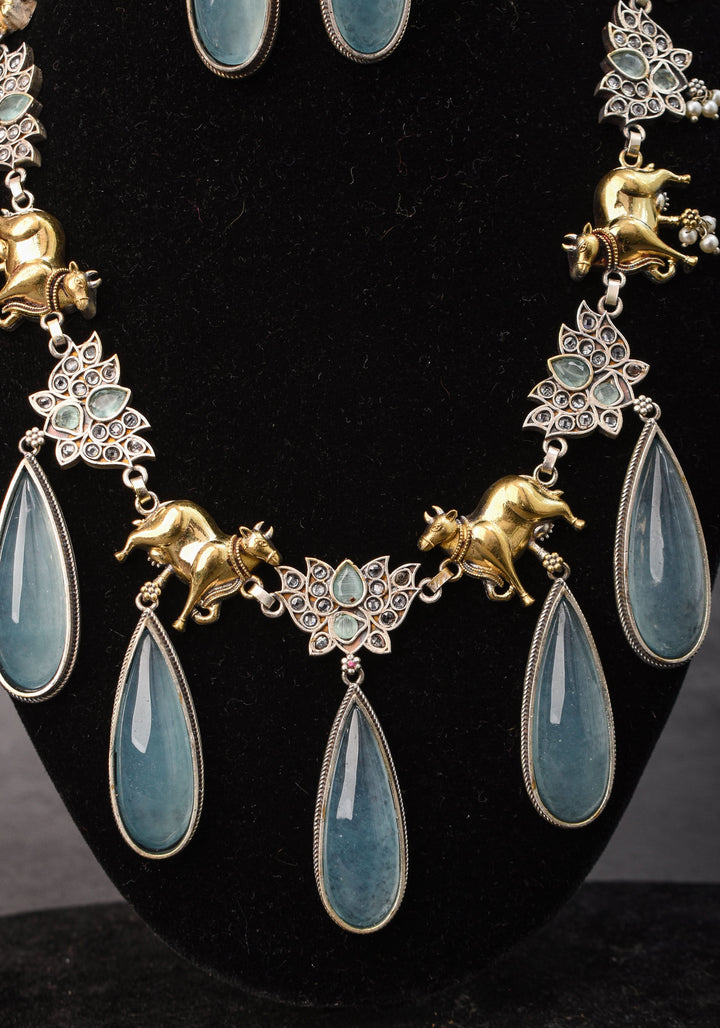 Fusion Dual Tone Jewelry with Pichwai Cow Units and Heather Blue Stones | Shobitam Jewelry