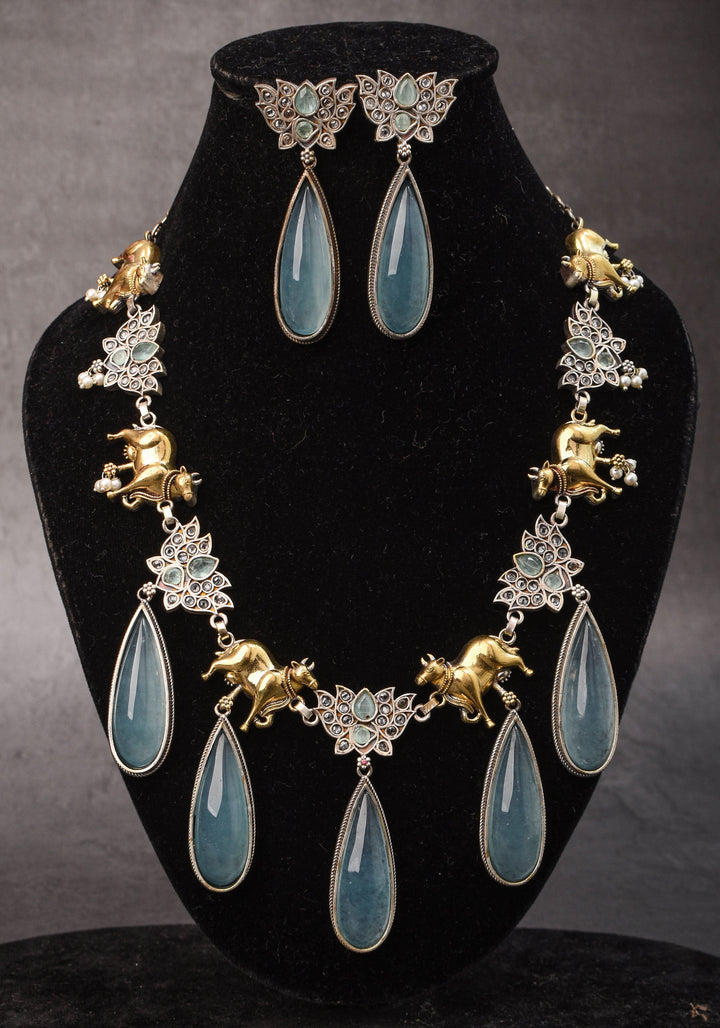 Fusion Dual Tone Jewelry with Pichwai Cow Units and Heather Blue Stones | Shobitam Jewelry