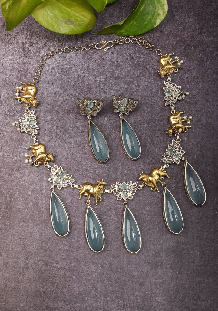 Fusion Dual Tone Jewelry with Pichwai Cow Units and Heather Blue Stones | Shobitam Jewelry
