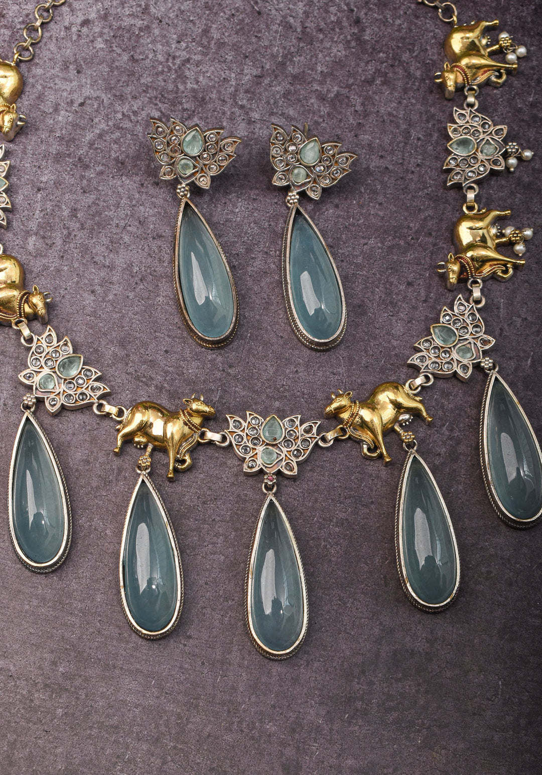 Fusion Dual Tone Jewelry with Pichwai Cow Units and Heather Blue Stones | Shobitam Jewelry