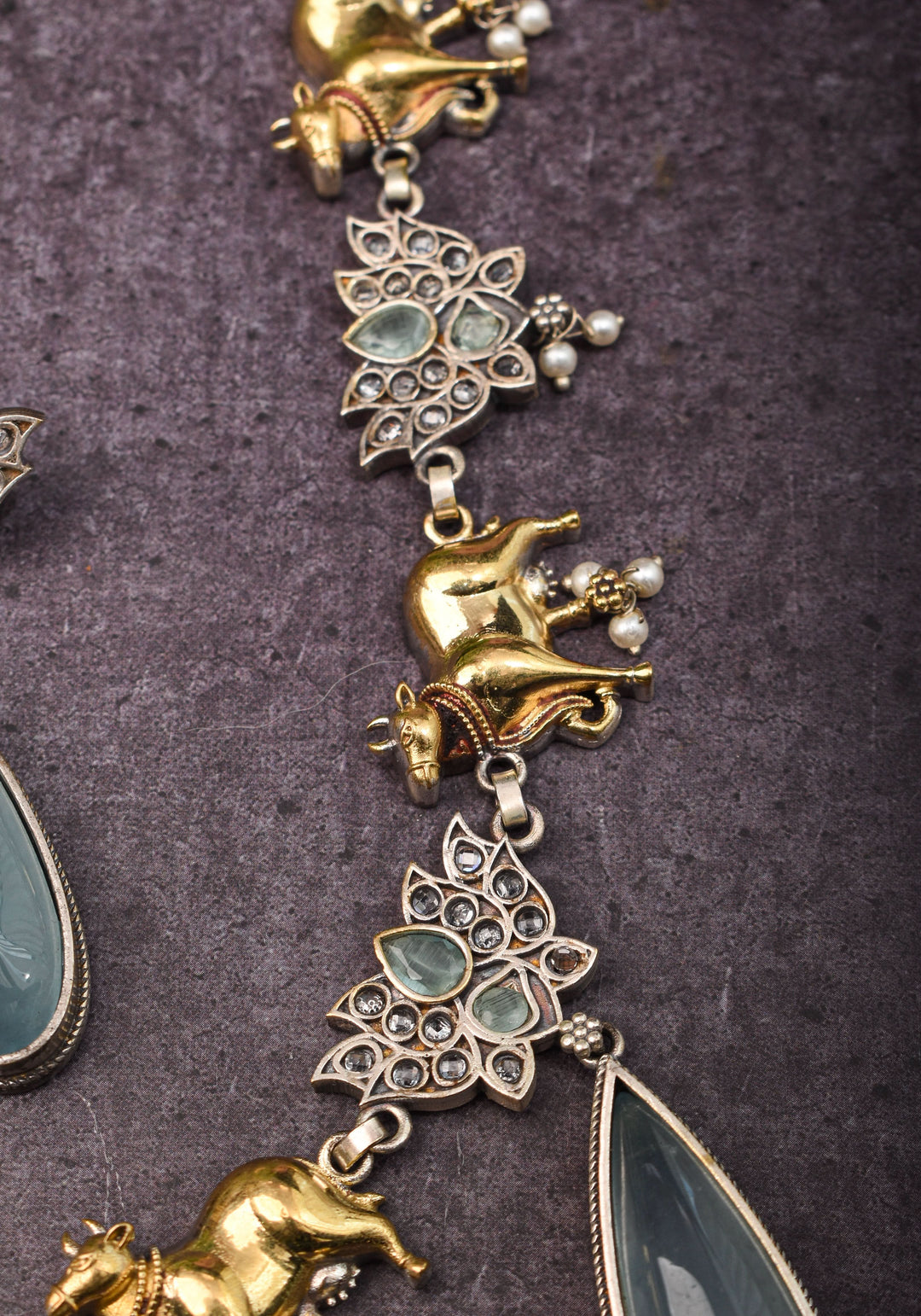 Fusion Dual Tone Jewelry with Pichwai Cow Units and Heather Blue Stones | Shobitam Jewelry
