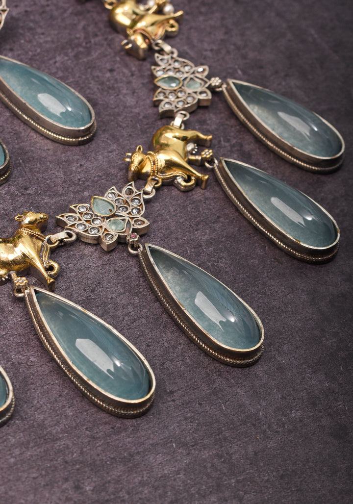 Fusion Dual Tone Jewelry with Pichwai Cow Units and Heather Blue Stones | Shobitam Jewelry
