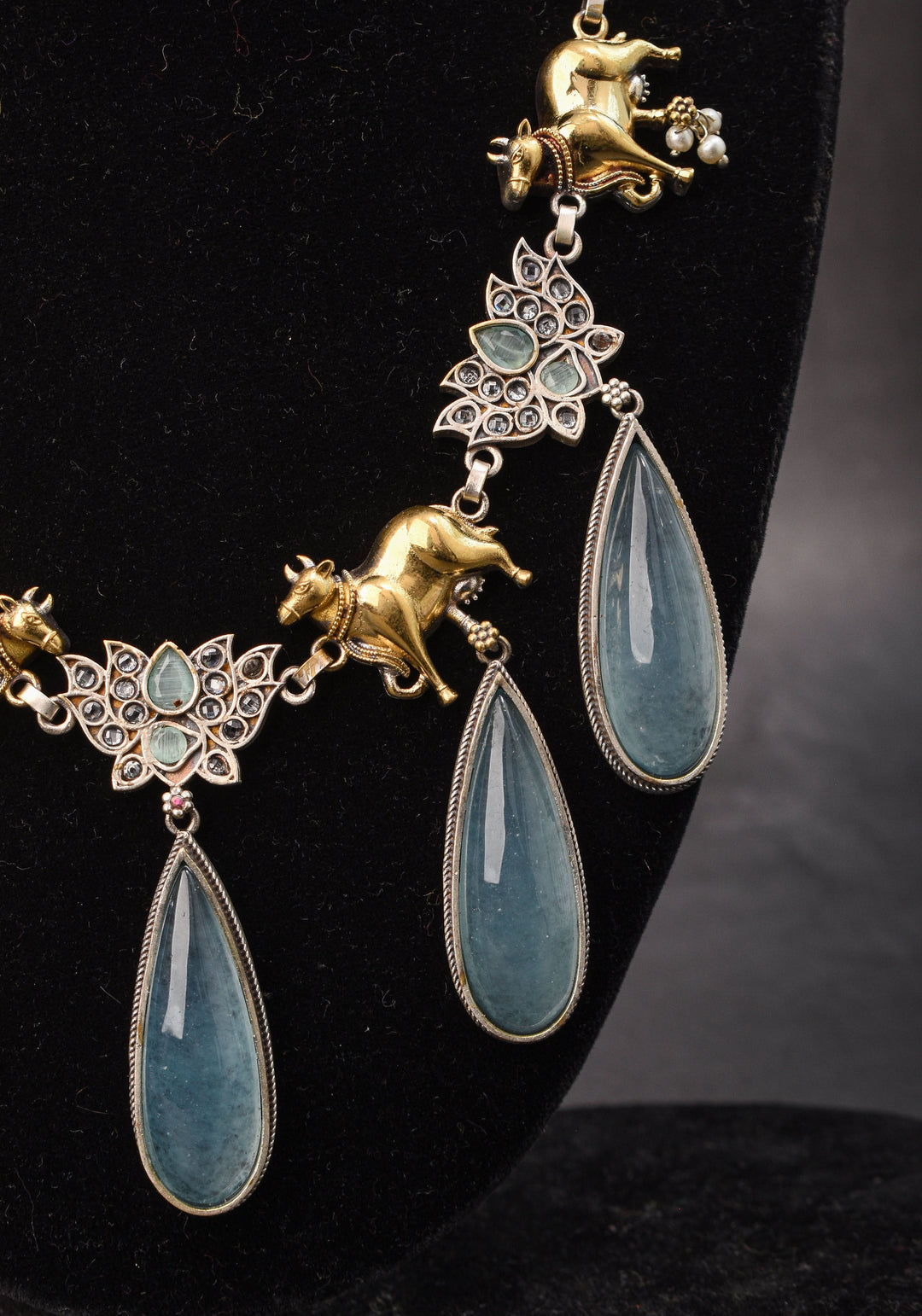 Fusion Dual Tone Jewelry with Pichwai Cow Units and Heather Blue Stones | Shobitam Jewelry