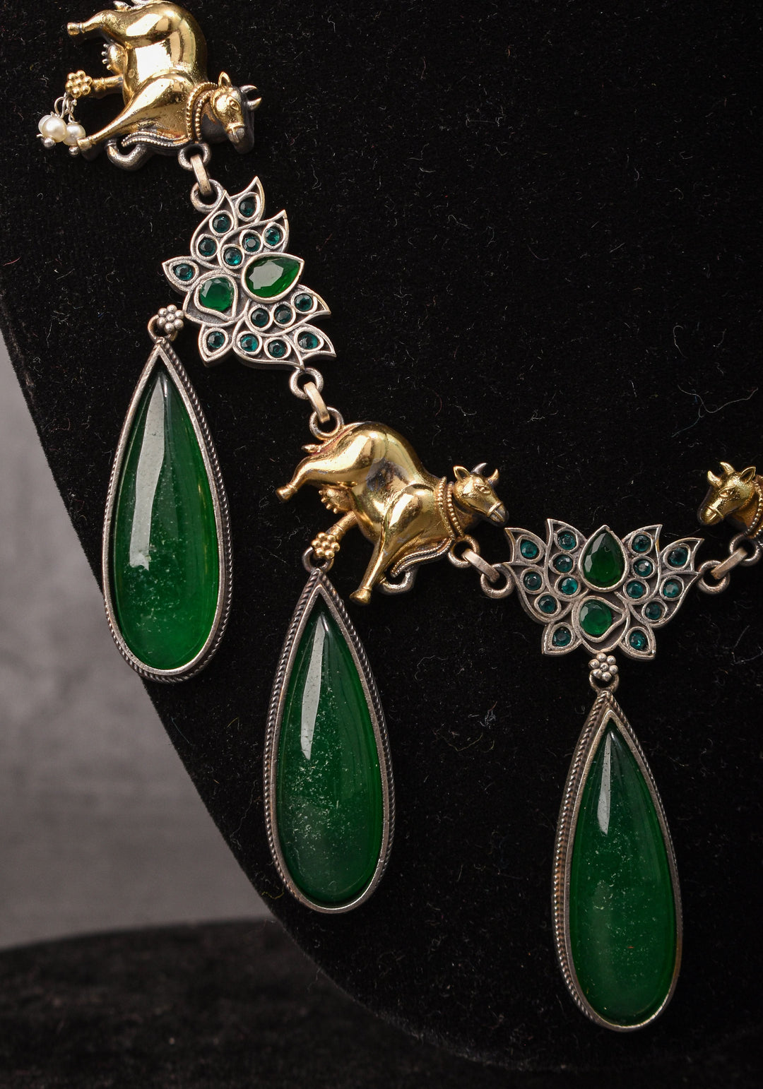 Fusion Dual Tone Jewelry with Pichwai Cow units and Green stones | Shobitam Jewelry