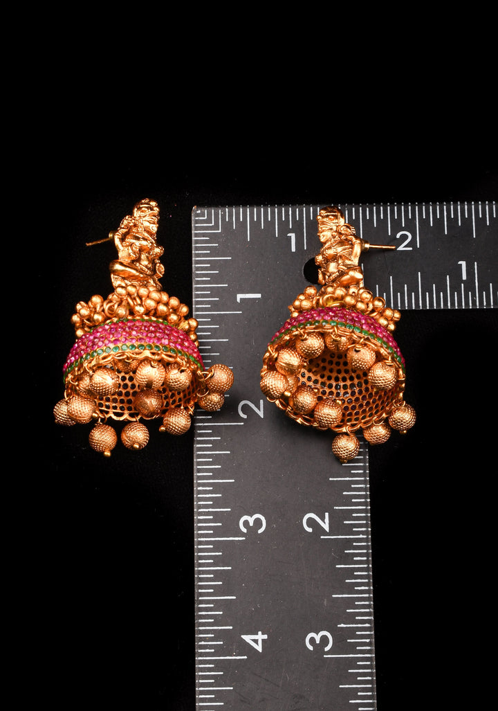 Traditional Antique Finish Gold Lakshmi Jhumkas with powder red stones and Gold Beads
