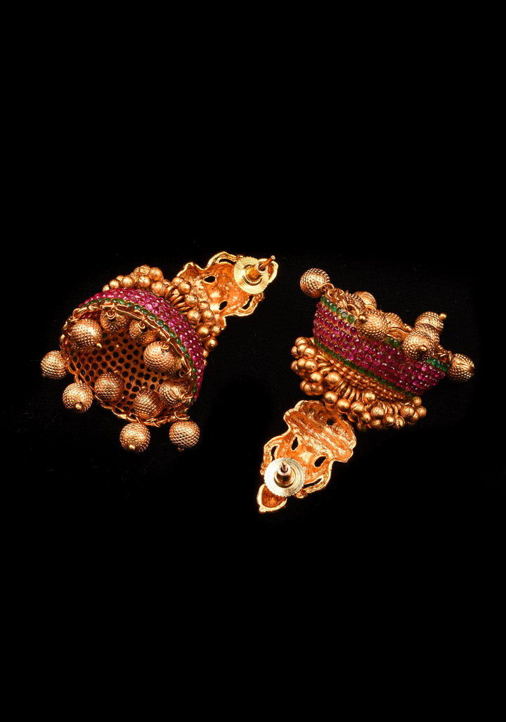 Traditional Antique Finish Gold Lakshmi Jhumkas with powder red stones and Gold Beads