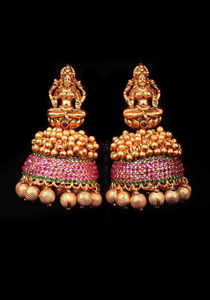 Traditional Antique Finish Gold Lakshmi Jhumkas with powder red stones and Gold Beads