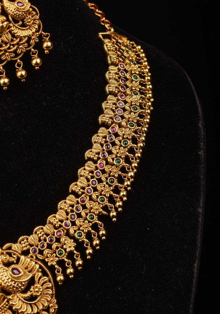 Antique Finish Necklace Set with Lakshmi Peacock and Stone Embellishments