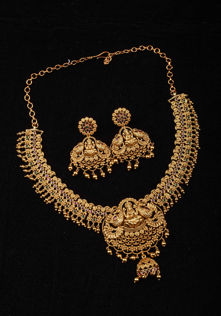 Antique Finish Necklace Set with Lakshmi Peacock and Stone Embellishments