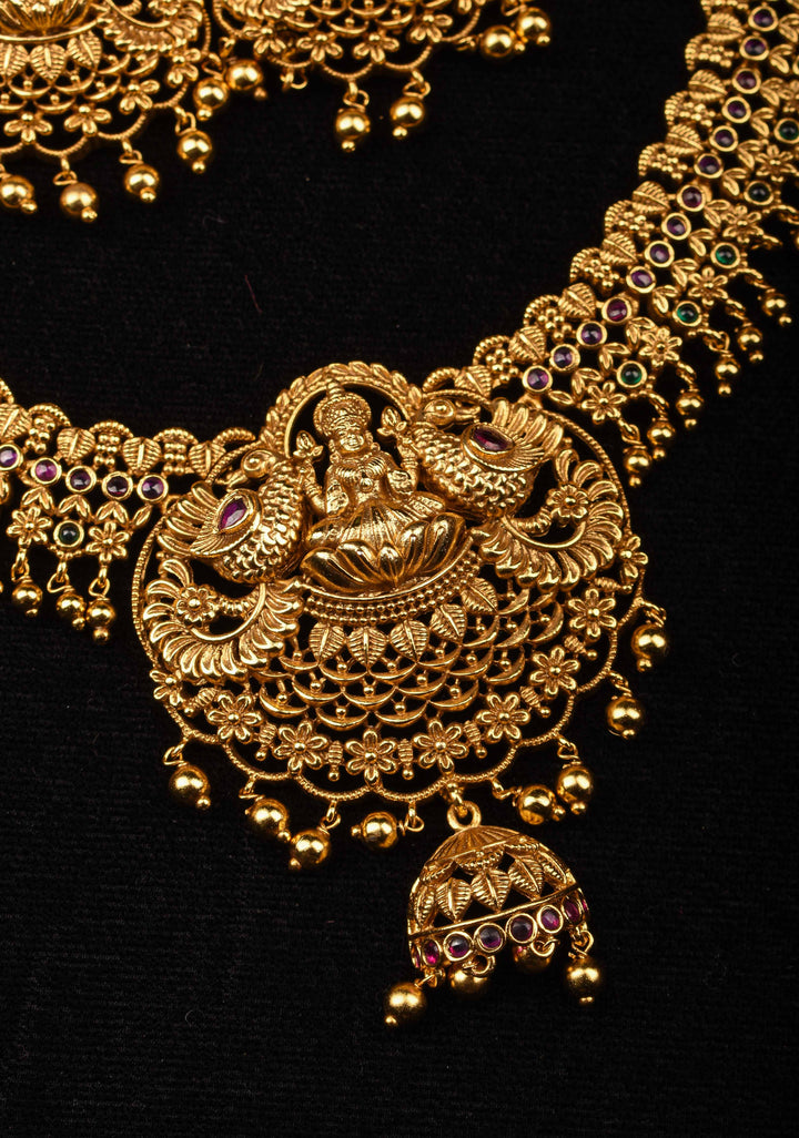 Antique Finish Necklace Set with Lakshmi Peacock and Stone Embellishments