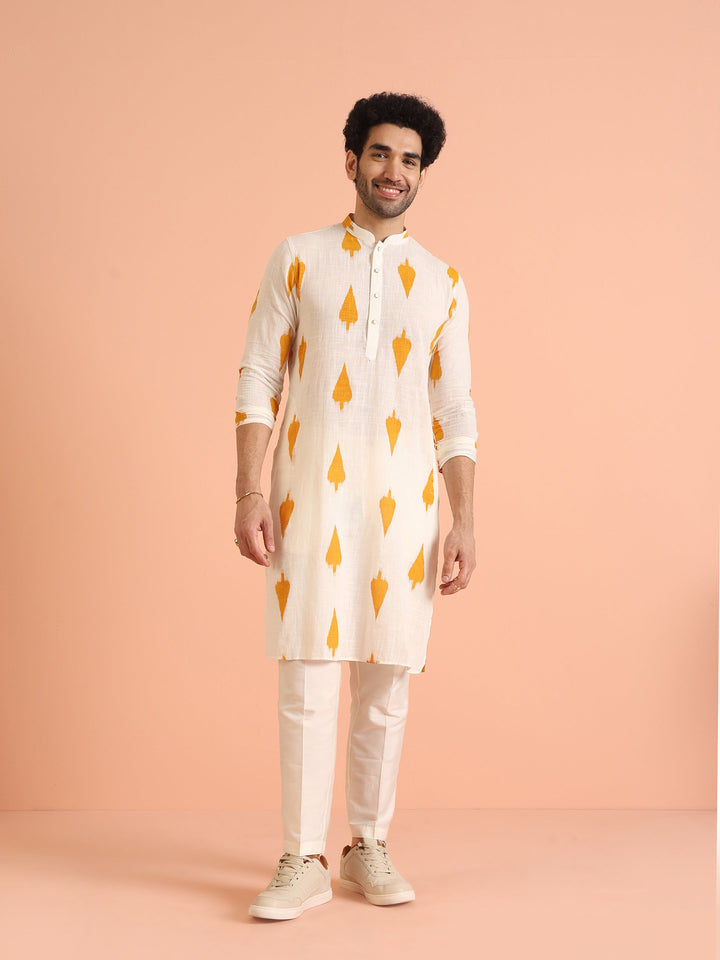 White Cotton Kurta Set with Mustard Ikat-Inspired Prints and Cream Trousers – Festive & Wedding Ensemble | SHOBITAM