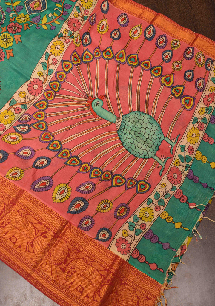 Floral Theme : Teal Authentic Pen kalamkari on pure Chennuri Silk Saree with zari border and Peacock motif on Pallu