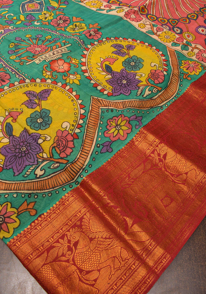 Floral Theme : Teal Authentic Pen kalamkari on pure Chennuri Silk Saree with zari border and Peacock motif on Pallu