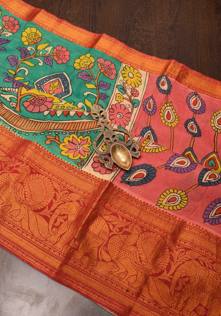 Floral Theme : Teal Authentic Pen kalamkari on pure Chennuri Silk Saree with zari border and Peacock motif on Pallu