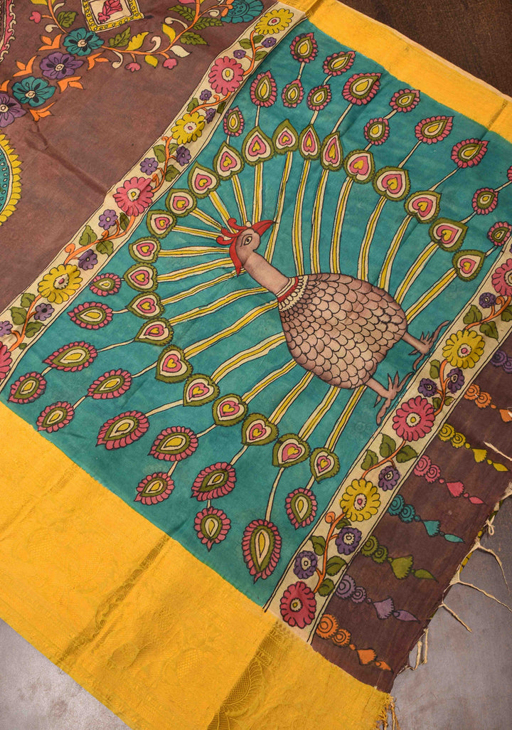 Floral Theme : Brown Authentic Pen kalamkari on Bangalore Silk Saree with zari border and Peacock motif on Pallu