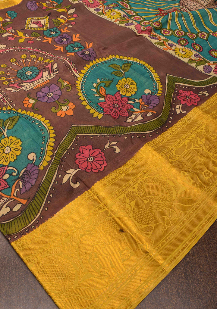 Floral Theme : Brown Authentic Pen kalamkari on Bangalore Silk Saree with zari border and Peacock motif on Pallu