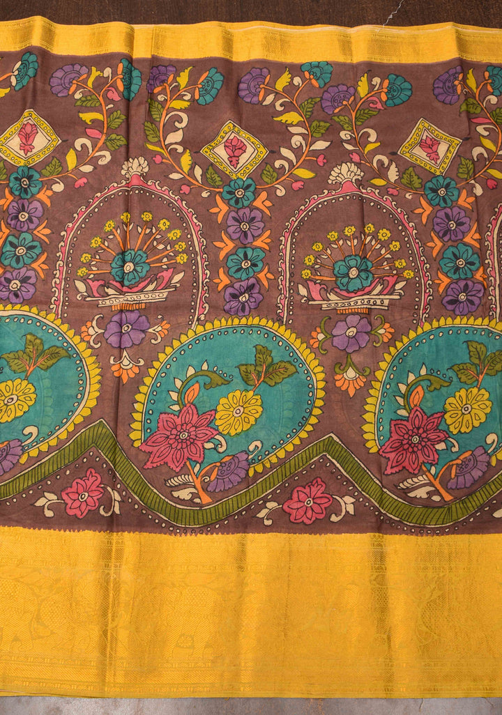 Floral Theme : Brown Authentic Pen kalamkari on Bangalore Silk Saree with zari border and Peacock motif on Pallu