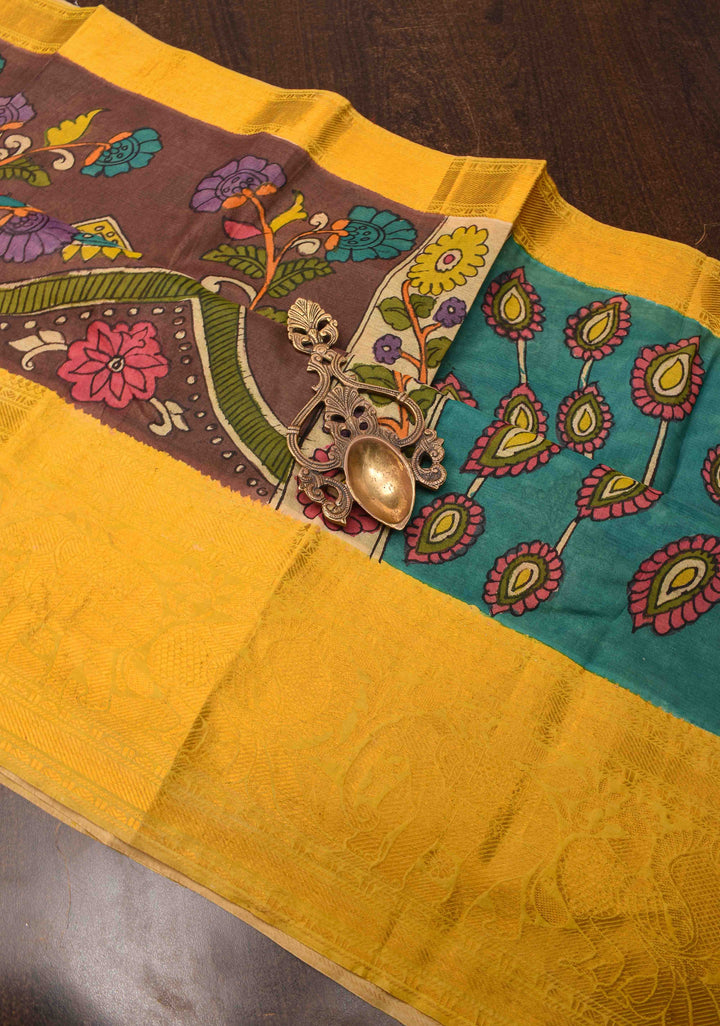 Floral Theme : Brown Authentic Pen kalamkari on Bangalore Silk Saree with zari border and Peacock motif on Pallu