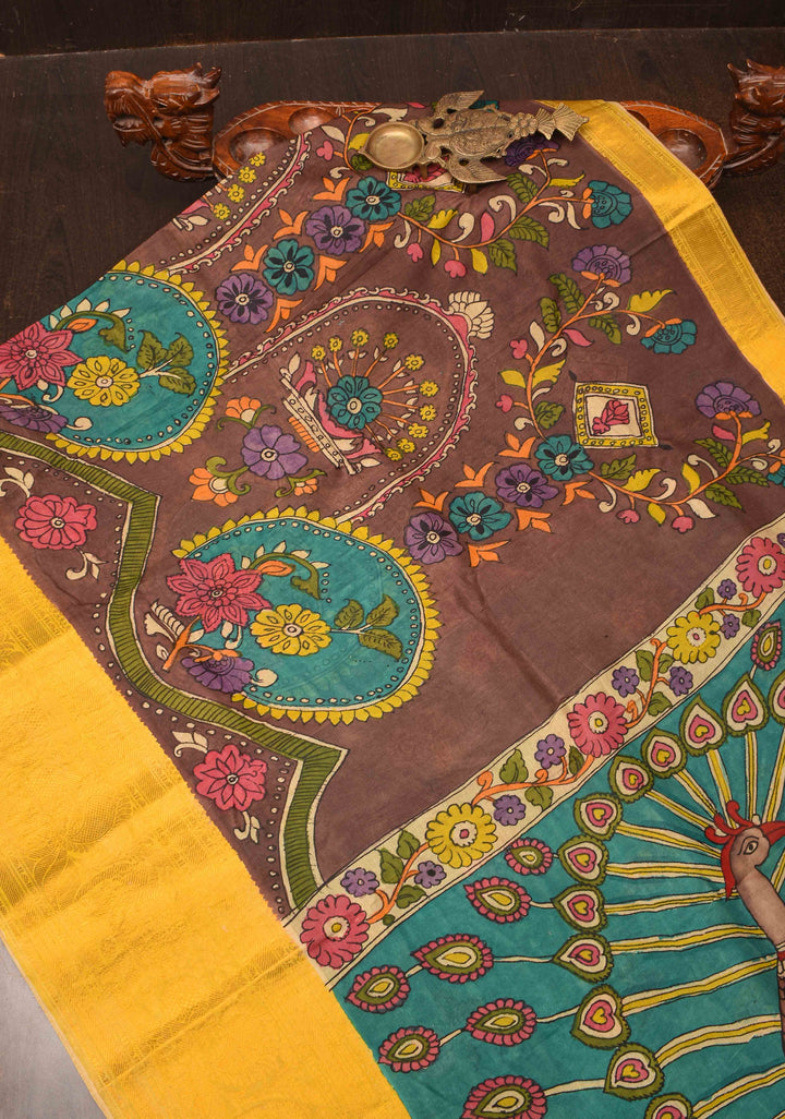 Floral Theme : Brown Authentic Pen kalamkari on Bangalore Silk Saree with zari border and Peacock motif on Pallu