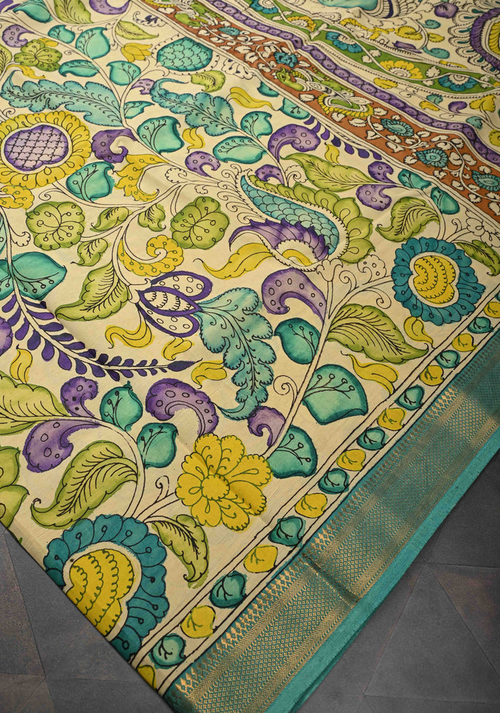 Annapakshi and Floral Theme : Beige Authentic Pen kalamkari on Mangalagiri Silk Saree with Zari Border