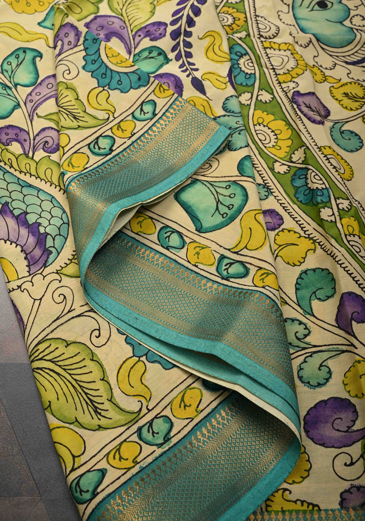 Annapakshi and Floral Theme : Beige Authentic Pen kalamkari on Mangalagiri Silk Saree with Zari Border