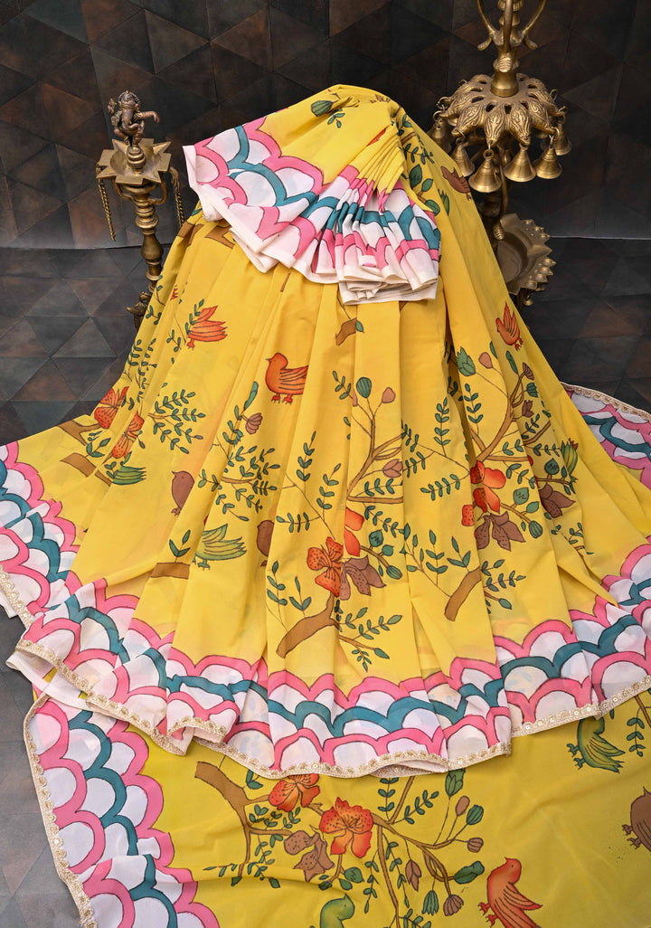 Floral and Birds Theme : Yellow Authentic pen kalamkari on pure Georgette Silk Saree with Lace Border | SILK MARK CERTIFIED