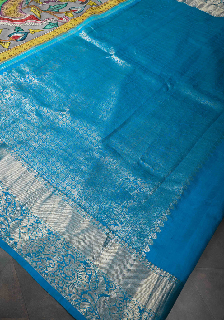 Krishna and Pichwai Theme :  Authentic Gray Pen kalamkari on Pure Kanjivaram Silk Saree with Azure Blue Contrast base Zari Border | SILK MARK CERTIFIED