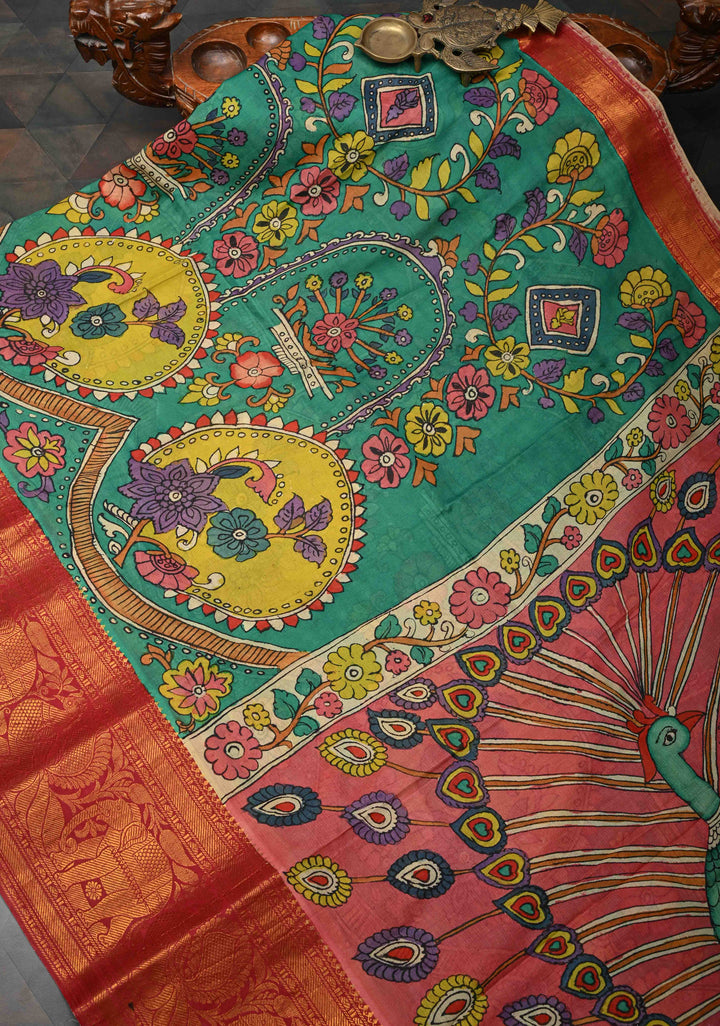 Floral and Peacock Theme : Green Authentic Pen kalamkari on Pure Chennuri Silk Saree with Wide Zari Border
